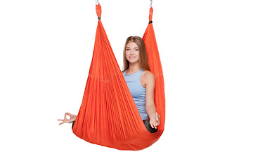 Image showing Young woman doing anti-gravity aerial yoga