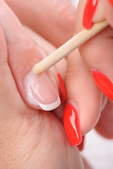 Image showing manicure applying - cleaning the cuticles 