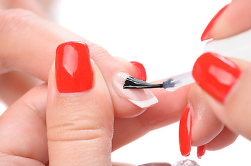 Image showing manicure, applying clear enamel