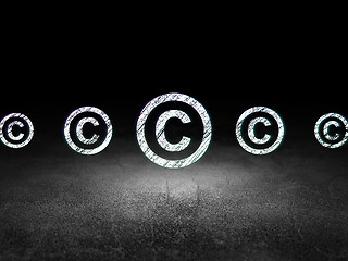 Image showing Law concept: copyright icon in grunge dark room