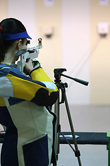 Image showing woman aiming a pneumatic air rifle