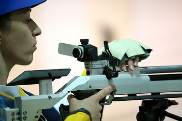 Image showing woman aiming a pneumatic air rifle