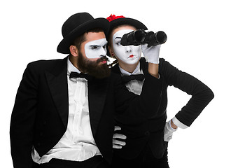 Image showing Two memes as business people looking through binoculars 