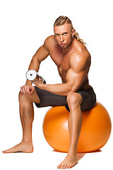 Image showing Shaped and healthy body man sitting on fitness ball 