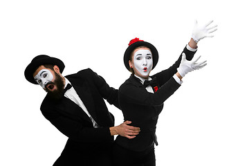 Image showing mime holding another one up and running
