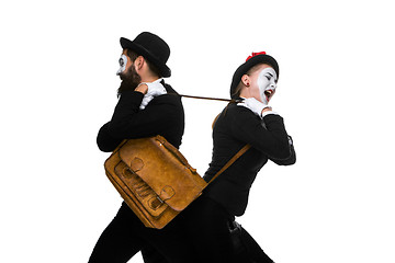 Image showing Business man and woman fighting over briefcase