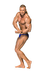 Image showing Attractive male body builder on white background