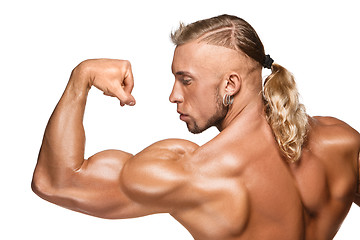 Image showing Attractive male body builder on white background