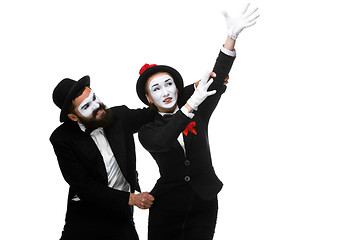 Image showing mime holding another one up and running