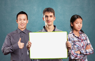 Image showing Asian team and male with write board in his hands