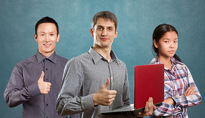 Image showing Asian team and man with laptop in his hands and woman