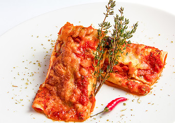 Image showing Mexican chicken enchiladas with spicy tomato sauce and cheese.