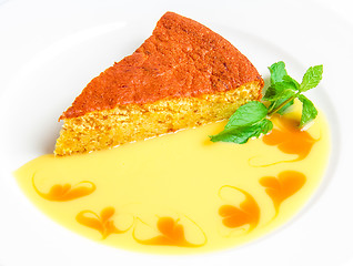 Image showing Piece of cake with yellow sauce