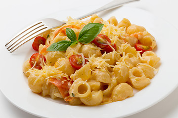 Image showing Cream and tomato pasta with fork