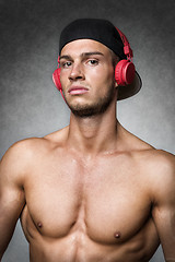 Image showing Athlete with cap and headphones
