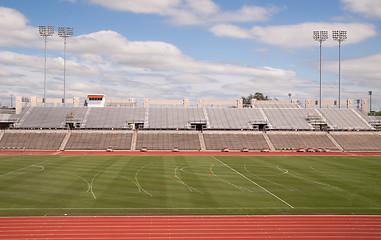 Image showing College Level Track Stadium Puffy Clouds Blue Sky