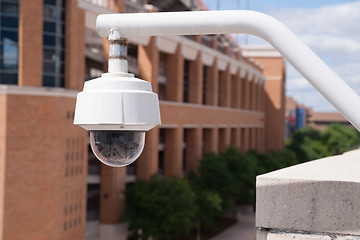 Image showing Video Security Camera Housing Mounted High on College Campus