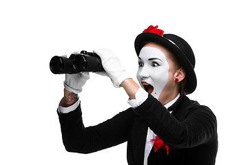 Image showing Portrait of the surprised and joyful mime with binoculars