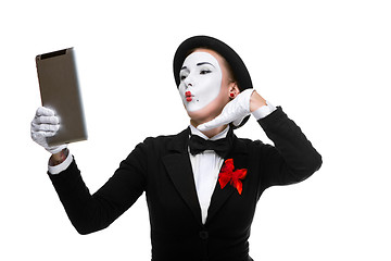 Image showing business woman in the image mime holding tablet PC