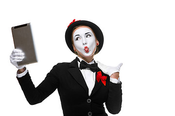 Image showing business woman in the image mime holding tablet PC