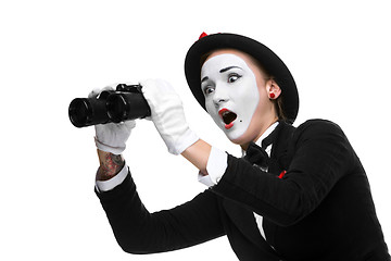 Image showing Portrait of the surprised and joyful mime with binoculars