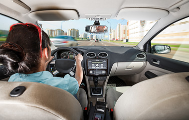 Image showing Woman behind the wheel of a car.