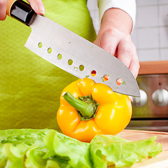 Image showing Woman\'s hands cutting vegetables