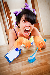 Image showing housewife washes a floor