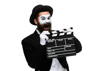 Image showing man in the image mime with movie board