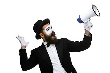 Image showing Man with a face mime screaming into megaphone 