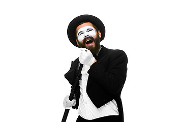 Image showing portrait of a man as mime with tube or retro style microphone