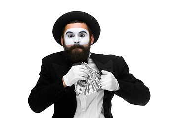 Image showing mime as businessman putting money in his pocket