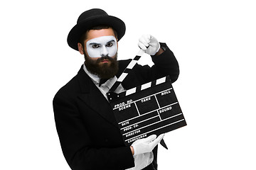 Image showing man in the image mime with movie board