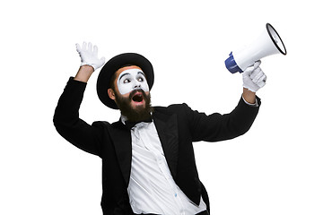 Image showing Man with a face mime screaming into megaphone 