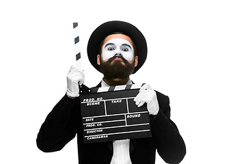 Image showing man in the image mime with movie board