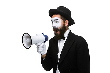 Image showing Man with a face mime screaming into megaphone 