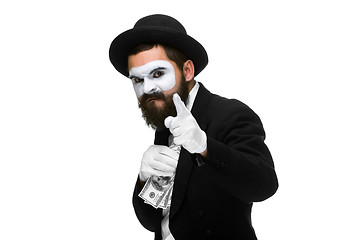 Image showing mime as businessman putting money in his pocket