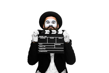 Image showing man in the image mime with movie board