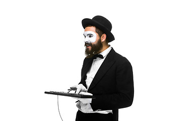 Image showing mime as a businessman holdinga keyboard