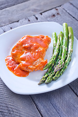 Image showing fried meat with sauce and asparagus