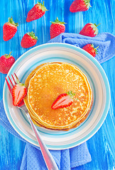Image showing pancakes on plate and fresh strawberries