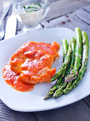 Image showing fried meat with sauce and asparagus