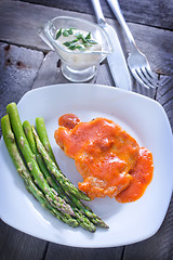 Image showing fried meat with sauce and asparagus