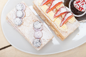 Image showing selection of fresh cream cake dessert plate 