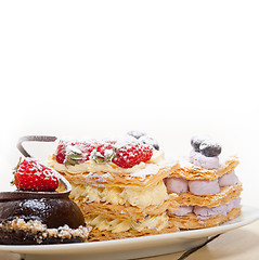 Image showing selection of fresh cream cake dessert plate 