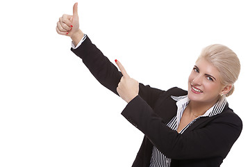 Image showing Businesswoman Pointing Up While Looking at Camera