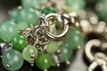 Image showing Green beads on an item of silver jewellery