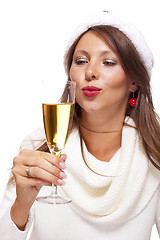 Image showing Playful woman celebrating Xmas blowing a kiss