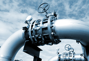 Image showing Industrial zone, Steel pipelines and valves against blue sky