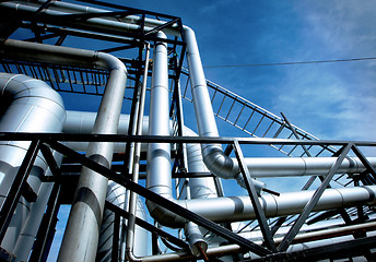 Image showing Industrial zone, Steel pipelines and valves against blue sky